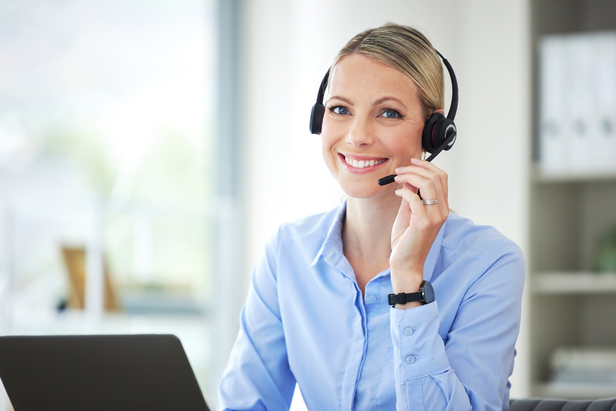 Call Centre Agent Using Her Laptop in the Office. Customer Servi